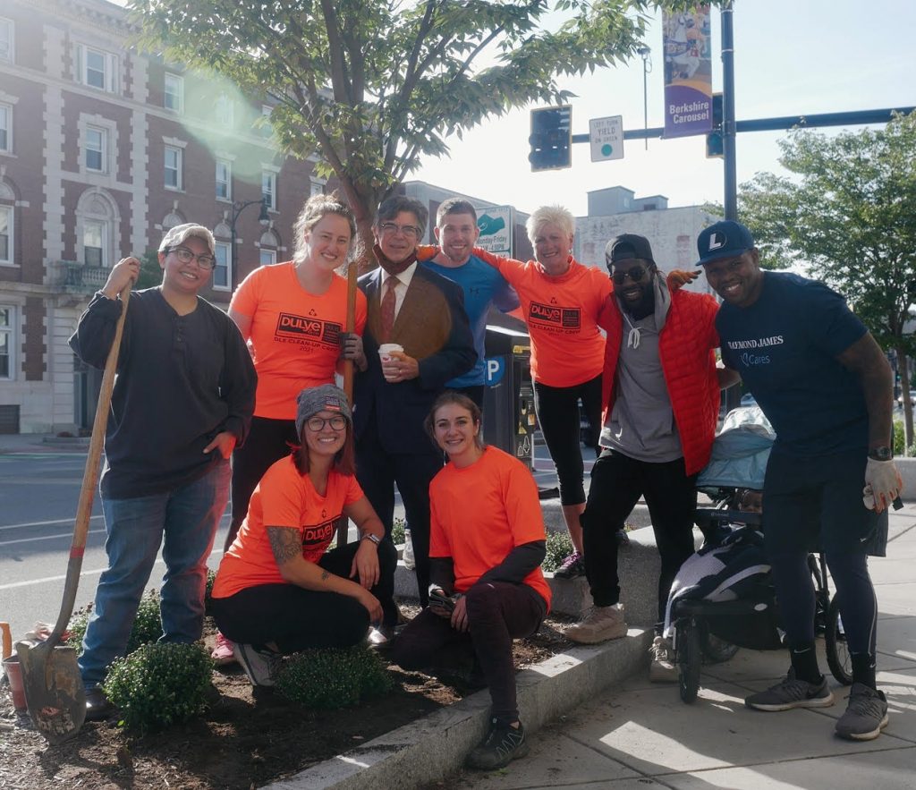 Steven Valenti (center, holding cup), North Street business owner of Steven Valenti’s Clothing for Men, with the DLE planting crew: Marie Meak, Kalee Carmel, Danielle Sanders, Michelle Lopez, Jon Katz, Linda Dulye, AJ Enchill and Marcus Coleman